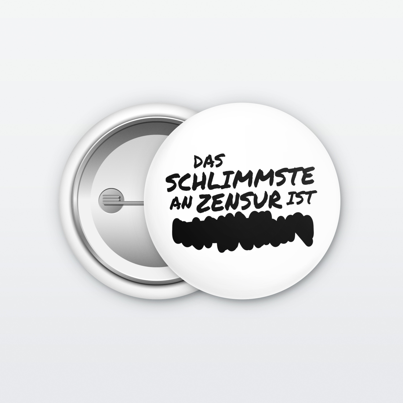 Ein weißer Button mit der Aufschrift: